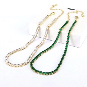 Gold-plated tennis necklaces with white and emerald green cubic zirconia in gift packaging
