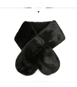 Detail of soft black faux fur scarf featuring a crossover closure for winter warmth