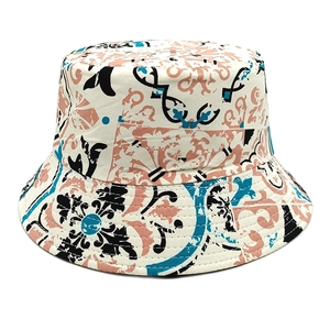 Detailed macro view of vintage bohemian pattern on canvas bucket hat with artistic print