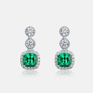 Elegant S925 silver drop earrings featuring cushion-cut emeralds and sparkling accents