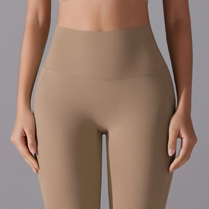 Close-up of khaki high-waisted yoga pants with wide waistband for tummy control