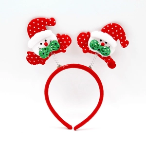 Detail of Christmas headband with spring-mounted snowmen and red polka dot hats
