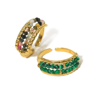 Detail of adjustable gold rings with colorful and green malachite beaded accents