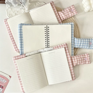 Floral fabric cover notebooks with button closure in pink and light blue colors
