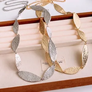Minimalist gold and silver leaf adjustable waist chain with hammered metal texture