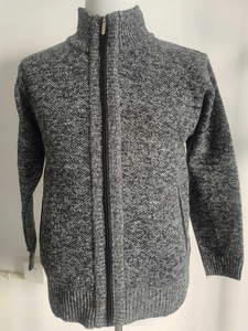 Detail of grey knitted cardigan with full zipper closure and stand collar for men
