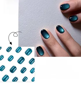 Close-up of deep green cat-eye short press-on nails featuring magnetic shimmer texture