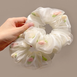 Floral mesh hair scrunchies in white translucent fabric with pink and yellow flower patterns