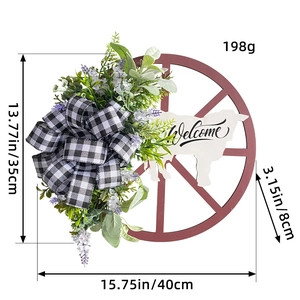 Cow head wheel wreath with welcome sign, greenery, and plaid bow for outdoor decor