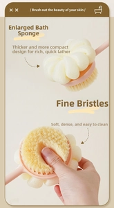 Detail of pink long handle bath brush showing soft bristles and yellow mesh sponge