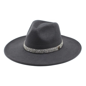 Detail of dark grey wool felt fedora with silver rhinestone band and metal M logo