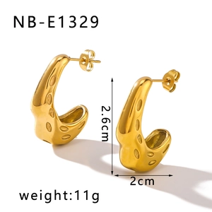 Macro shot of 18K gold plated stainless steel hoop earrings with hammered texture