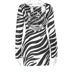 Detail of zebra print bodycon mini dress featuring an open back with delicate strap accents