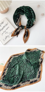 Detail of green and brown pleated scarf with animal print zebra and leopard patterns