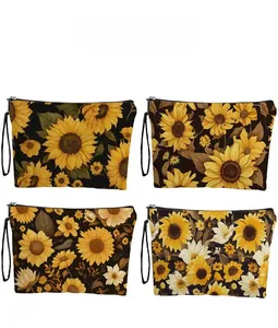 Detail showing four floral canvas cosmetic bags with sunflower prints and black zippers