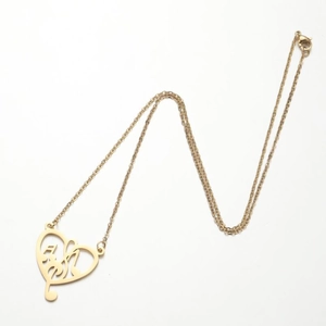 Golden heart necklace featuring an openwork musical note pendant on a fine link chain