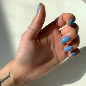 Minimalist S925 sterling silver thin band ring shown on a hand with simple glossy finish