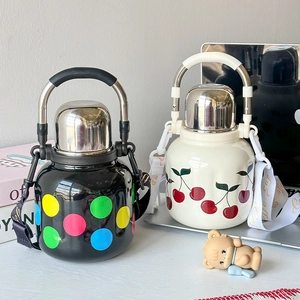 Creative 316 stainless steel vacuum flasks with polka dot and cherry prints on desktop