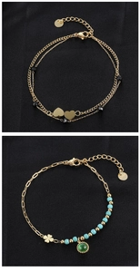 Detailed view of gold stainless steel bracelets with turquoise beads and clover charms