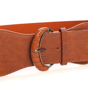 Detail of wide brown elastic belt featuring faux crocodile leather texture and wrapped buckle