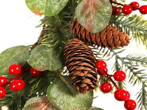 Close-up of Christmas wreath featuring red berries, pine needles, and natural pine cones