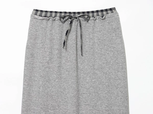 Detail of grey elastic waist midi skirt with black and white plaid belt and drawstring