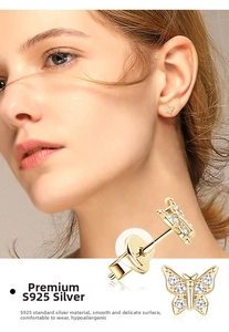 Detail of S925 sterling silver butterfly stud earrings with sparkling cubic zirconia stones
