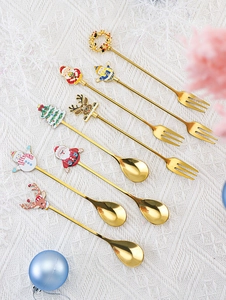 Set of 8 gold stainless steel spoons and forks with festive Christmas cartoon toppers