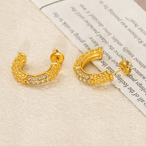 Elegant U-shaped gold earrings with studded crystals and beaded texture finish