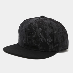 Detail of 3D embroidery and industrial lettering on the black flat brim snapback hat