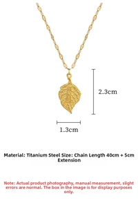 Macro view of gold leaf pendant showing Baifu engraving and titanium steel texture