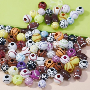 Macro view of assorted sports ball acrylic beads including football, basketball and tennis