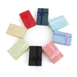 Set of eight colorful jewelry gift boxes with bows in a circular arrangement