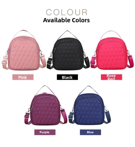 Detail of five mini quilted nylon bags in pink black rose purple and blue styles