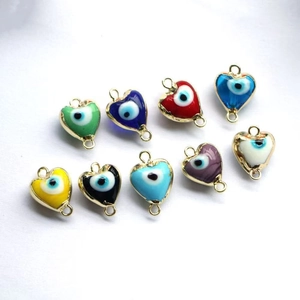 Colorful heart-shaped evil eye pendants in gold metal frames for DIY jewelry making