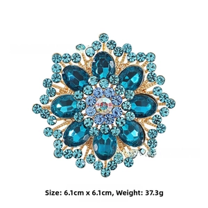 Detailed view of flower brooch dimensions 6.1cm by 6.1cm with blue crystals