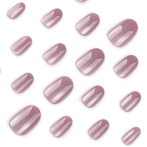 Short round cat-eye press-on nails in dusty rose with high-gloss mirror finish