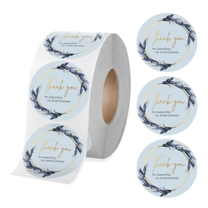 Detailed view of light blue round Thank You stickers with floral patterns on a roll