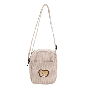 Cute off-white corduroy mini crossbody bag with a plush bear patch and adjustable strap