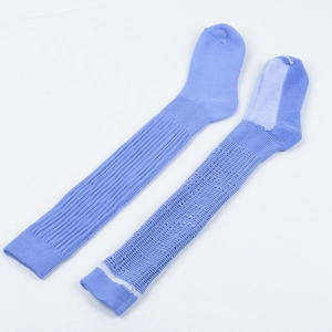 Close-up of light blue slouch socks featuring thick ribbed cotton knit texture