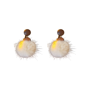 Vintage retro earrings featuring beige pompom and brown wooden geometric beads on white background