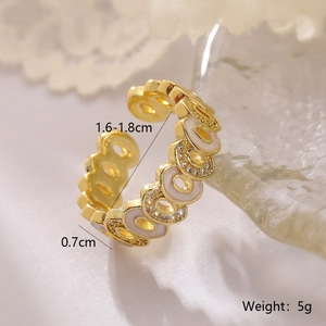 Macro detail of adjustable gold enamel ring with crystal accents and size dimensions