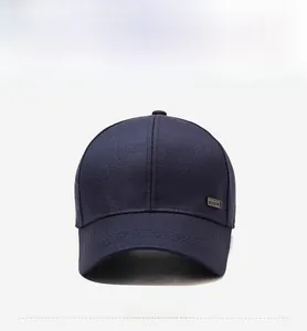 Front view of a dark blue baseball cap with twill cotton fabric and metal logo detail