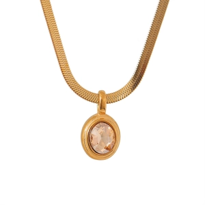 Detailed close-up of golden flat snake chain with an oval champagne zircon pendant