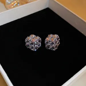 Three-dimensional square cubic zirconia stud earrings in a minimalist silver base design