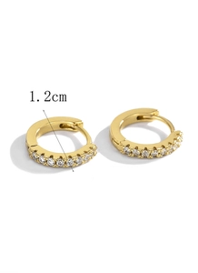Detail shot of 1.2cm gold hoop earrings with a single row of sparkling zircon stones