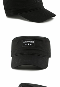 Close-up of a black flat top military cap featuring an embroidered ANDVODPH star patch