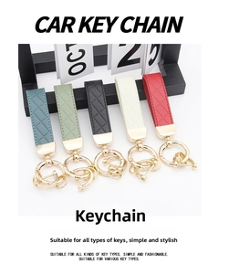 Detailed view of woven faux leather car keychains with golden metal rings in five colors