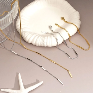 Minimalist stainless steel necklace and bracelet set in gold and silver finish