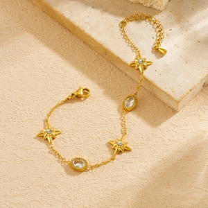 Gold plated stainless steel chain bracelet with star charms and oval cubic zirconia stones